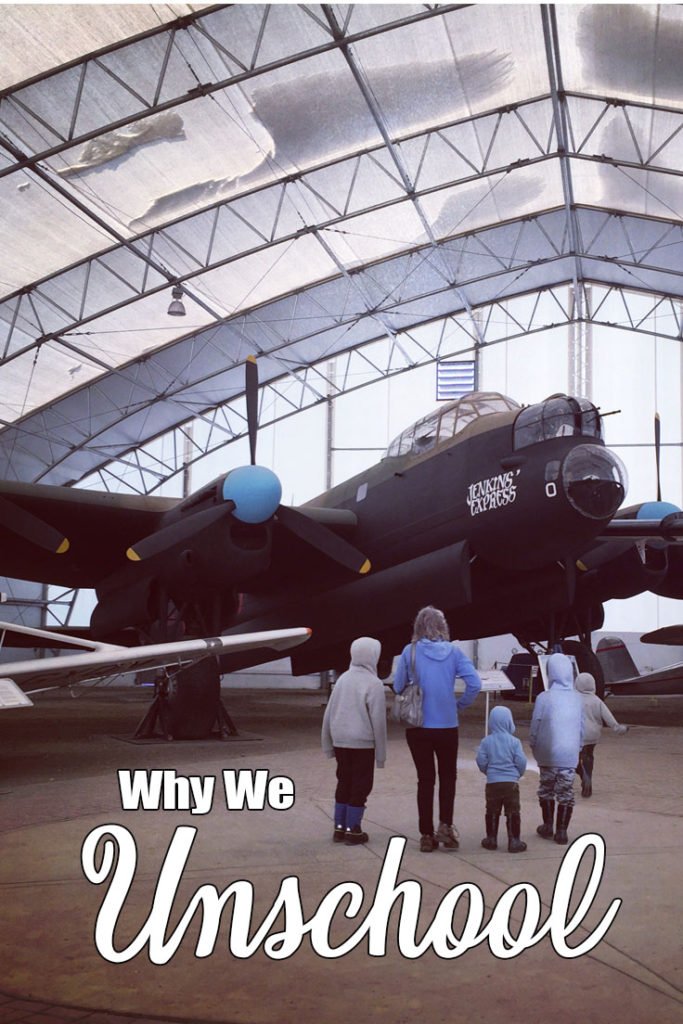 Why would anyone want to unschool?  The reason why we unschool is we want to embrace the curiosity and enjoyment of learning that children naturally have.  A group of 4 people, facing away from the camera, look up at a vintage Lancaster Bomber in the Heritage Warplane Museum - part of a homeschool field trip.