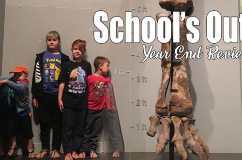 4 boys of different heights stand beside a size chart and a very large fossil of the leg and foot bones from a dinosaur. School's Out! It is summer and we are excited for warmer weather and new adventures. We just had our unschooling year-end meeting and are officially done!