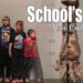 4 boys of different heights stand beside a size chart and a very large fossil of the leg and foot bones from a dinosaur. School's Out! It is summer and we are excited for warmer weather and new adventures. We just had our unschooling year-end meeting and are officially done!